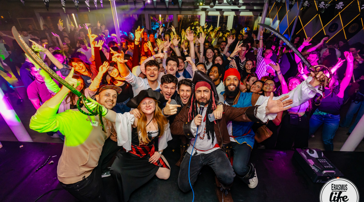 Energetic crowd at vibrant party.